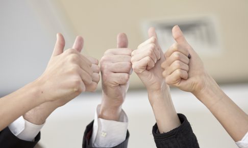business-team-put-thumbs-up-hands-together-1